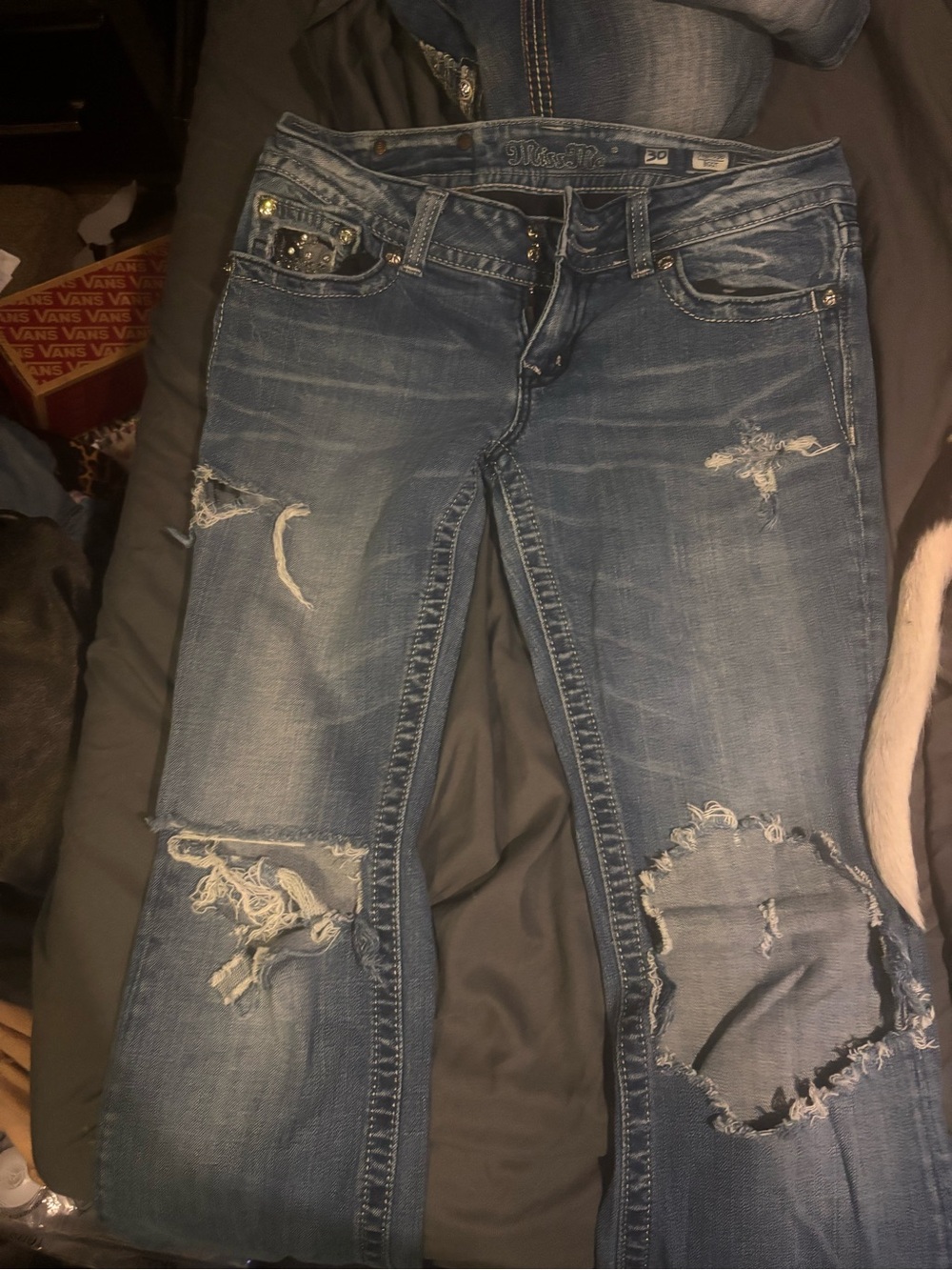 Distressed women’s miss me jeans